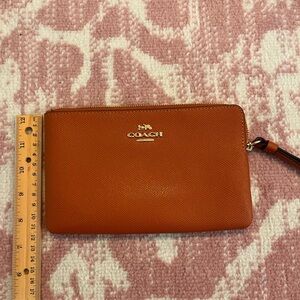 Burnt Orange Coach Wristlet